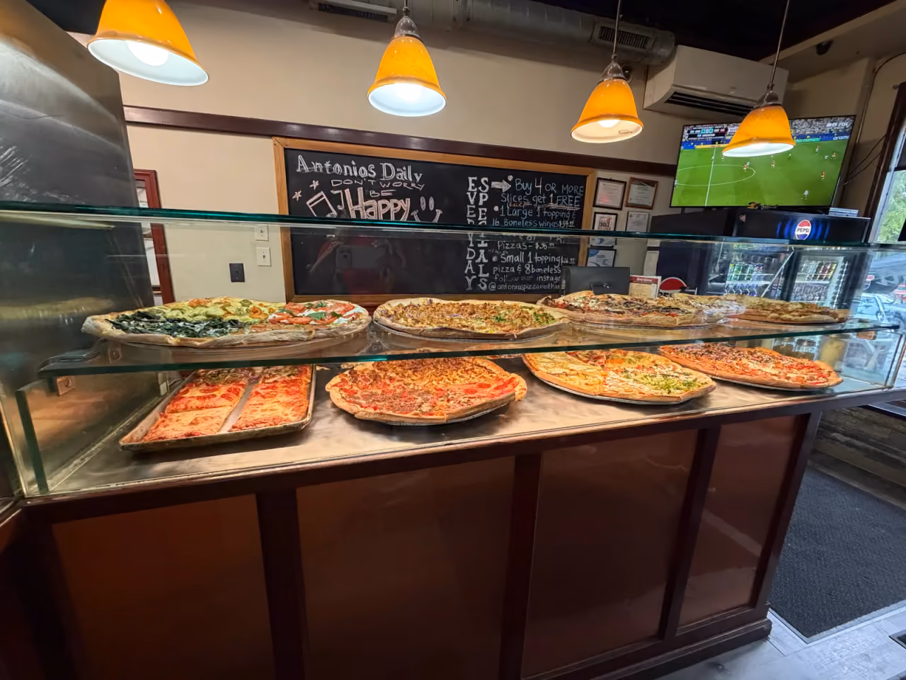 Antonio's Easthampton slice counter and daily-specials chalkboard